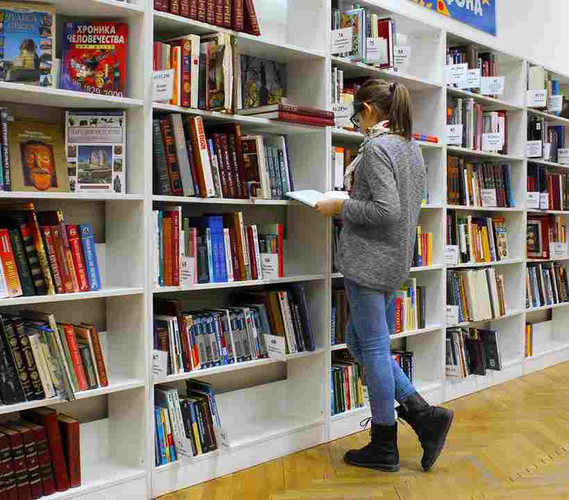 Interior of a world-class library with rows of bookshelves and reading tables